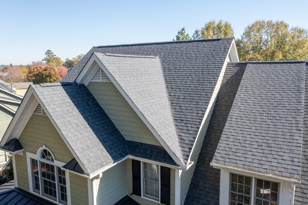 Photograph of a newly installed shingle roof, featuring clean rows of Certainteed asphalt shingles